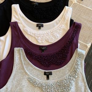 Woman’s tank tops with decorative chest/neckline.